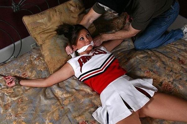 Cheerleader bound and gagged in bed